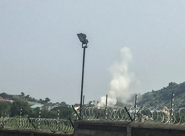 Plumes of smoke rise after South Sudanese government attack helicopters hovered over the Checkpoint district of the capital Juba, near the Jebel district which has seen some of the heaviest fighting, on July 11, 2016. 

