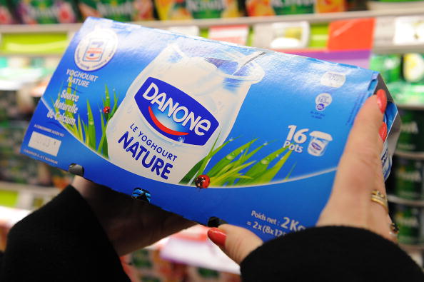 A customer selects Danone yogurt in a supermarket in Paris, France, on Tuesday, Feb. 9, 2010. 