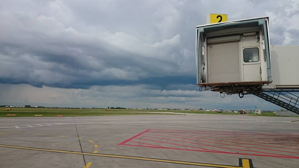 In this file photo from July 2016, a funnel is shown over Saskatoon John G. Diefenbaker International Airport.