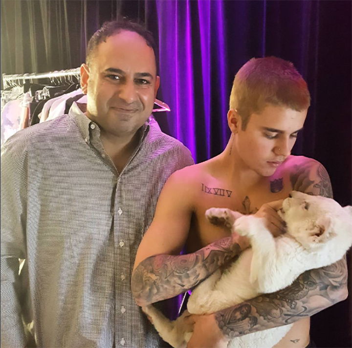 Justin Bieber is seen holding a lion cub in Toronto in May 2016.