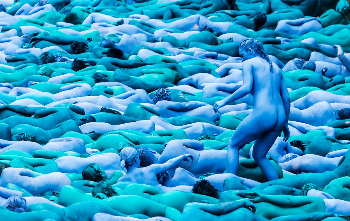 People manoeuvre into position as they take part in a mass nude art installation entitled Sea of Hull by New York based artist Spencer Tunick in Hull, England, Saturday July 9, 2016.