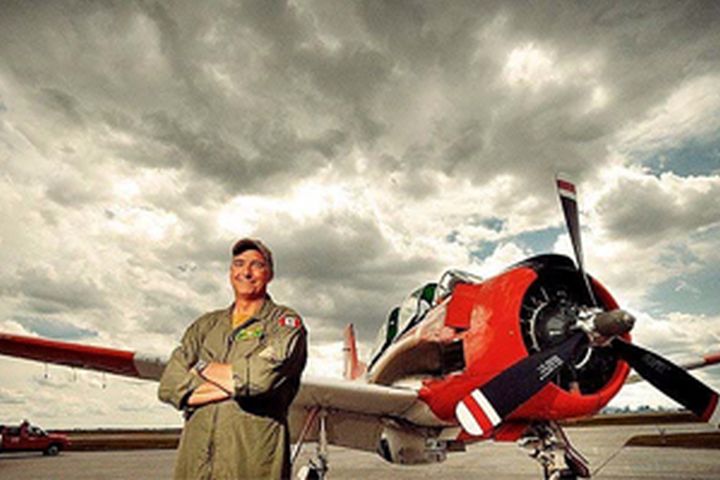 Pilot Bruce Evans, pictured with his Trojan T-28 aircraft.