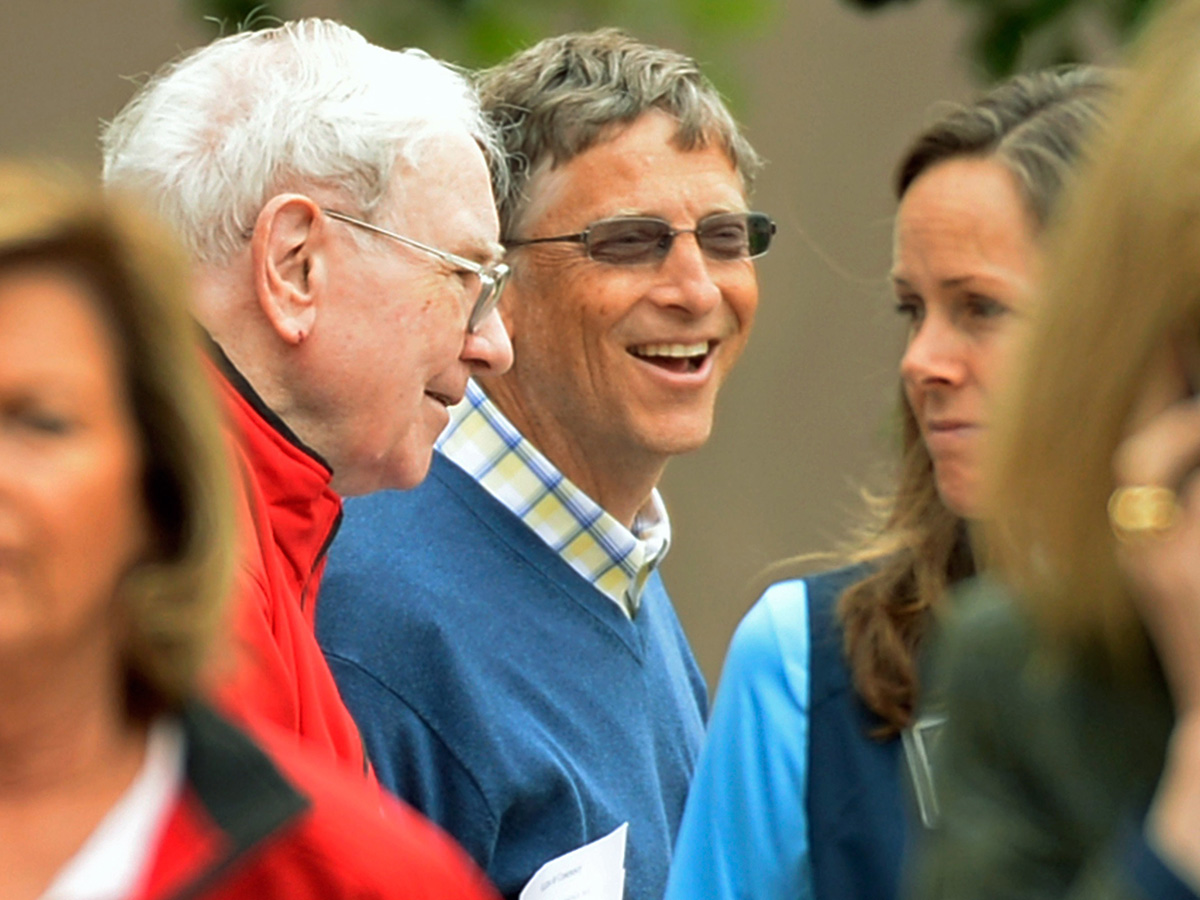 Chairman of Microsoft Bill Gates (R) and chairman and CEO of Berkshire Hathaway Warren Buffett break for lunch during the Allen & Co. annual conference at the Sun Valley Resort on July 11, 2013 in Sun Valley, Idaho.