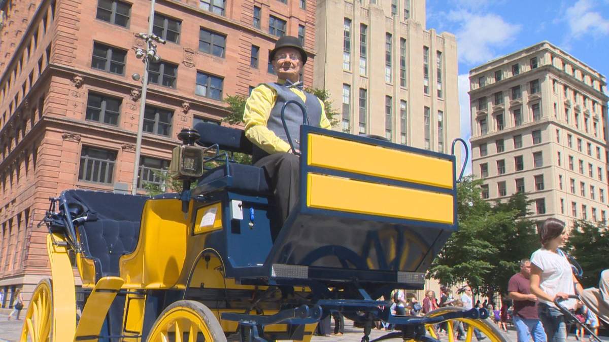 Jacques Prud'homme on his electric, horseless calèche in Montreal's Old Port, Tuesday, July 19, 2016.