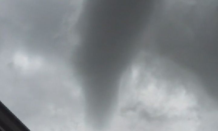 A funnel cloud is spotted over the south Calgary neighbourhood of Heritage Pointe on Thursday, July 28, 2016.