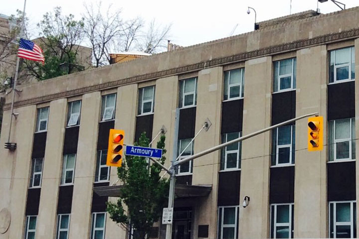 A woman has been charged after police say a guard at the U.S. consulate in Toronto was attacked.