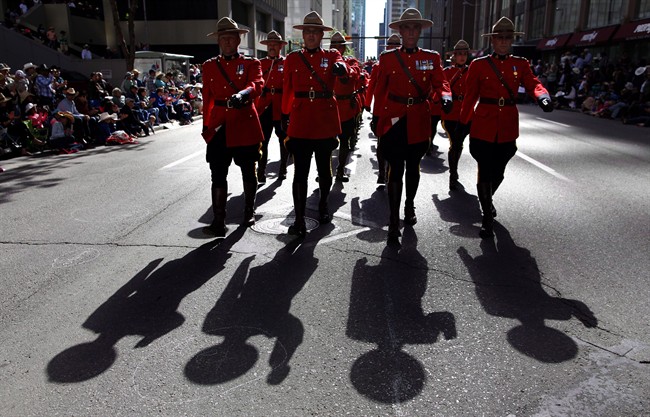Members of the RCMP march during the Calgary Stampede parade in Calgary.