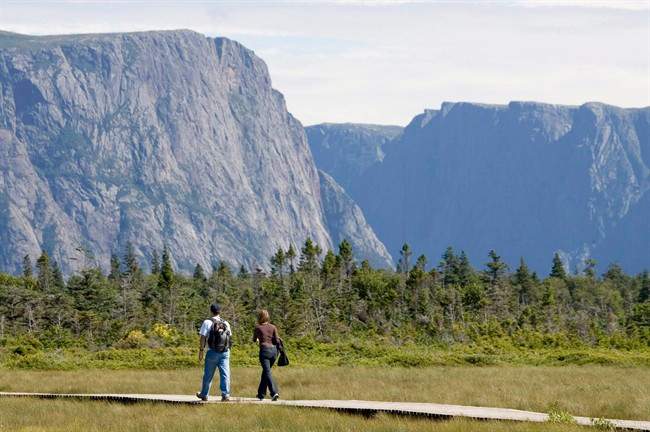 A couple walk along a boardwalk on their way to Western Brook Pond in Gros Morne, N.L., on August 14, 2007.