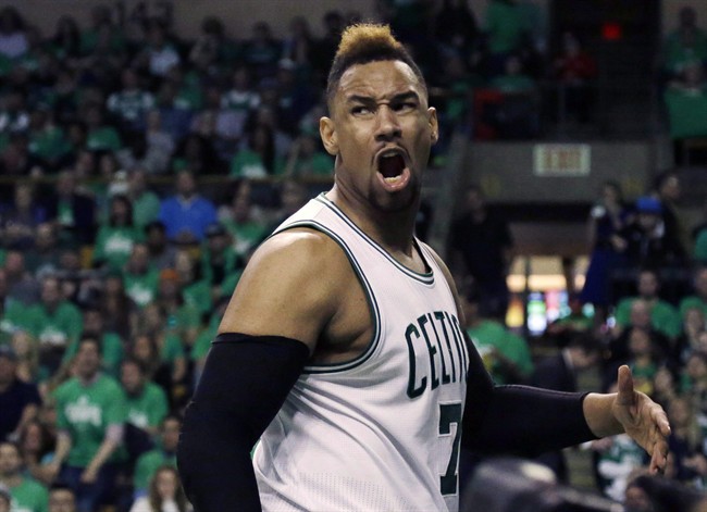 Boston Celtics center Jared Sullinger yells after being fouled by Atlanta Hawks forward Kent Bazemore during the third quarter in Game 3 of a first-round NBA basketball playoff series in Boston on April 22, 2016. 