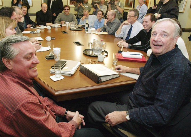 ** Liberal Leader Paul Martin (right) holds a meeting with head of his transition team, Mike Robinson (left), in Ottawa on Friday November 21, 2003. 