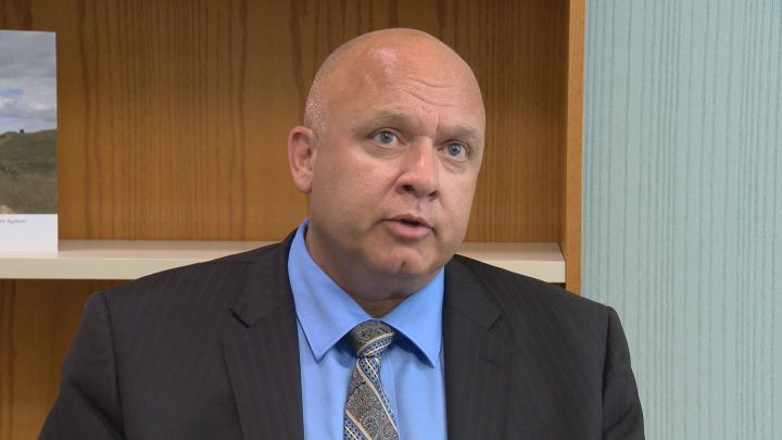 Dan Florizone, the Saskatoon Health Region's CEO, says officials will try to minimize layoffs with a hiring freeze and by having current employees to fill vacant roles.