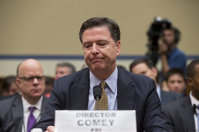 FBI Director James Comey pauses while testifying on Capitol Hill in Washington, Thursday, July 7, 2016, before the House Oversight Committee to explain his agency's recommendation to not prosecute Hillary Clinton, now the Democratic presidential candidate, over her private email setup during her time as secretary of state.