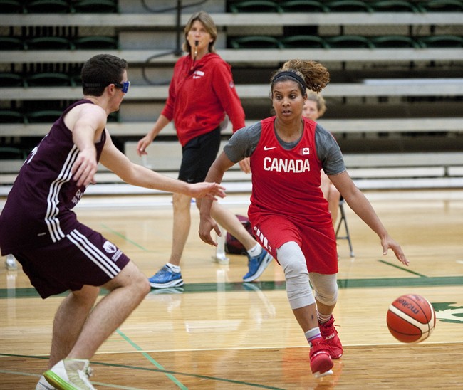 Miah-Marie Langlois, right, practices under the watchful eye of assistant coach Bev Smith during the Canadian women's national basketball team's practice in Edmonton, Alta., on Thursday, July 8, 2016. 