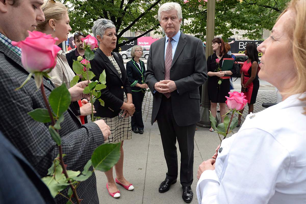 British High Commissioner to Canada Howard Drake, middle right, joins others as they take part in an event titled 'More In Common: A Worldwide Celebration of Jo Cox' at the British High Commission in Ottawa on Wednesday, June 22, 2016. 