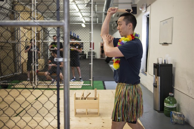 Howard An, who is getting married in October, has fun with his friends at an Axe Throwing club as part of his bachelor party, in Toronto on Saturday July 9 , 2016. 