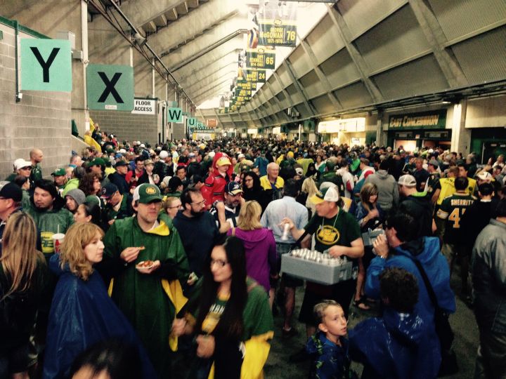 Edmonton Eskimos fans take shelter at Commonwealth Stadium as lightning forces the Eskimos game against the Winnipeg Blue Bombers to be delayed.