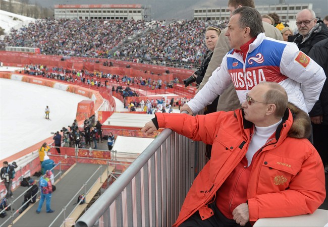 Russian President Vladimir Putin watches downhill ski competition of the 2014 Winter Paralympics in Roza Khutor mountain district of Sochi, Russia on March 8, 2014.