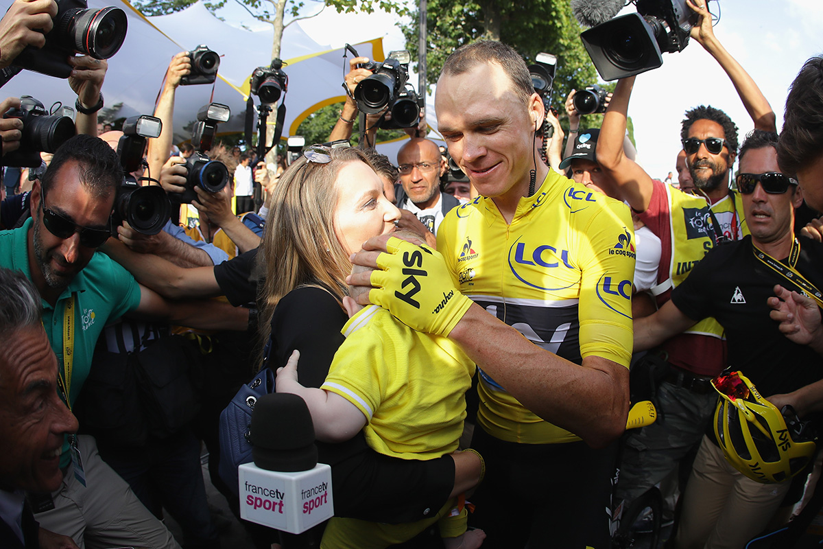Chris Froome of Great Britain and Team Sky celebrates victory with his family as he is surrounded by the media during Stage 21 of the 2016 Le Tour de France, from Chantilly to Paris Champs-Elysees on July 24, 2016 in Paris, France.  