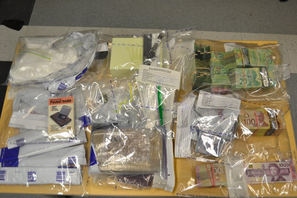 RCMP say they have seized  2.2 kilograms of cocaine, drug paraphernalia, 14.5 cases of contraband cigarettes and approximately $75,000.