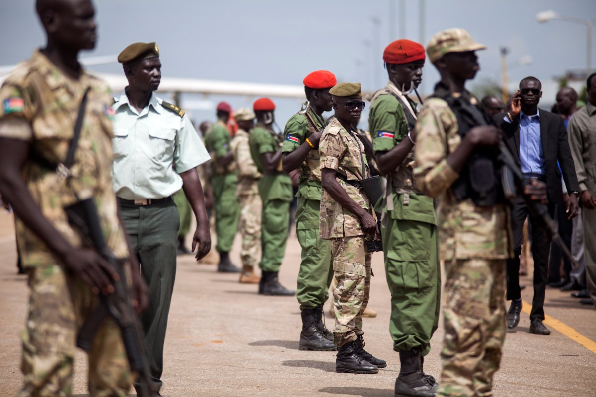 South Sudanese Government troops stand in formation before the arrival of General Simon Gatwech Dual, the chief of staff of the rebel troops of the Sudan People's Liberation Army in Opposition (SPLA-IO), at Juba International Airport on April 25, 2016.