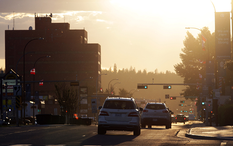 Trucks drive through downtown Fort McMurray, Alberta.