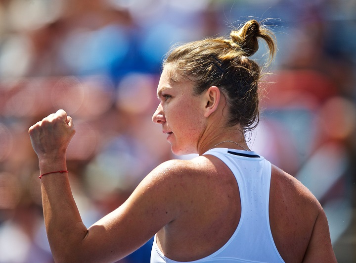 imona Halep of Romania celebrates a point against Angelique Kerber of Germany during the semifinal of the Rogers Cup Women's tennis tournament in Montreal, Canada, 30 July 2016.