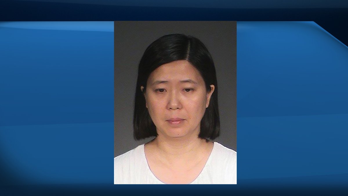 This photo provided by the Washington County Jail shows Lili Huang. The Minnesota woman, of Woodbury, is charged in Washington County with five felony counts, including labor trafficking, false imprisonment and assault.