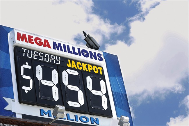 An electronic billboard displays the current Mega Millions jackpot, Tuesday, July 5, 2016, in Springfield, Ill. With slightly better odds than Powerball, it's rare that nearly four months passes without someone winning a Mega Millions jackpot, which has grown from $15 million prize to $454 million since the last winning drawing in March.