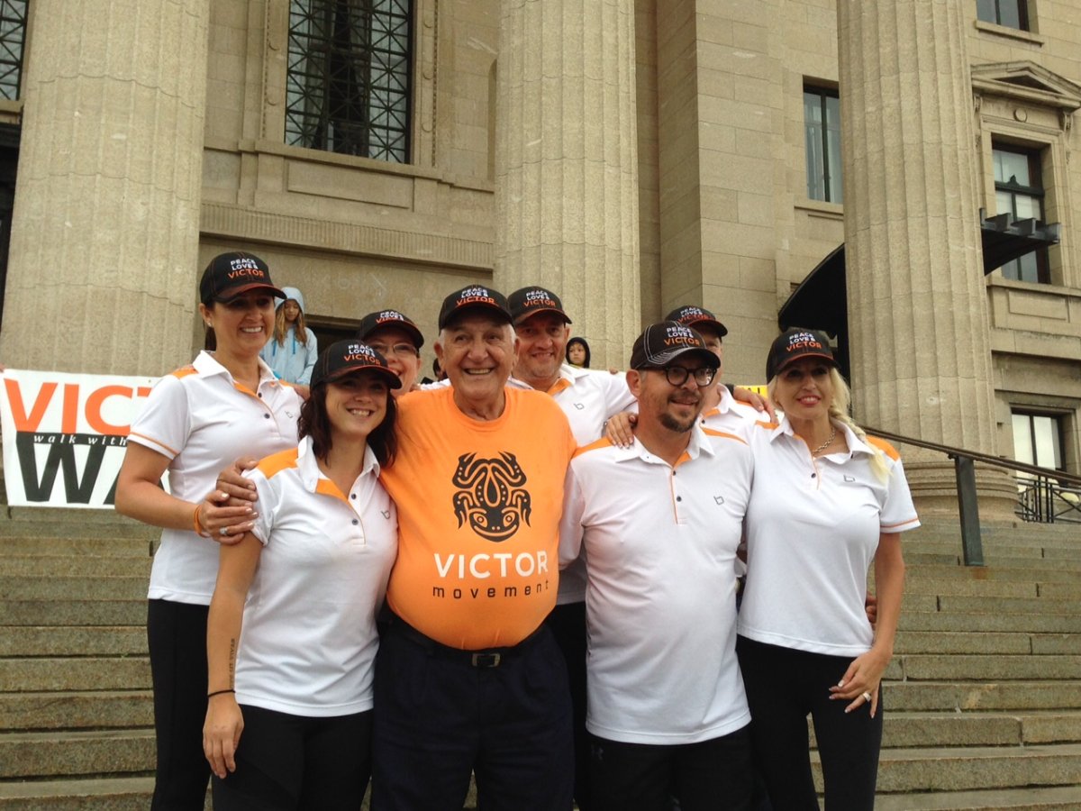 Theo Fleury (second from right) walked alongside dozens of survivors to raise awareness. 