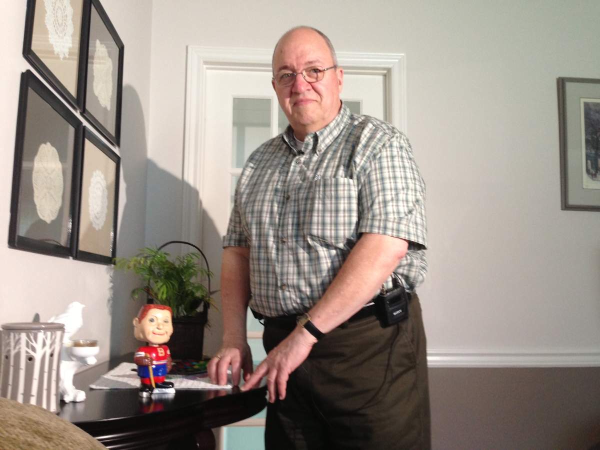 Normand MacDonald poses with Cash, his surprisingly valuable second-hand bobblehead find.