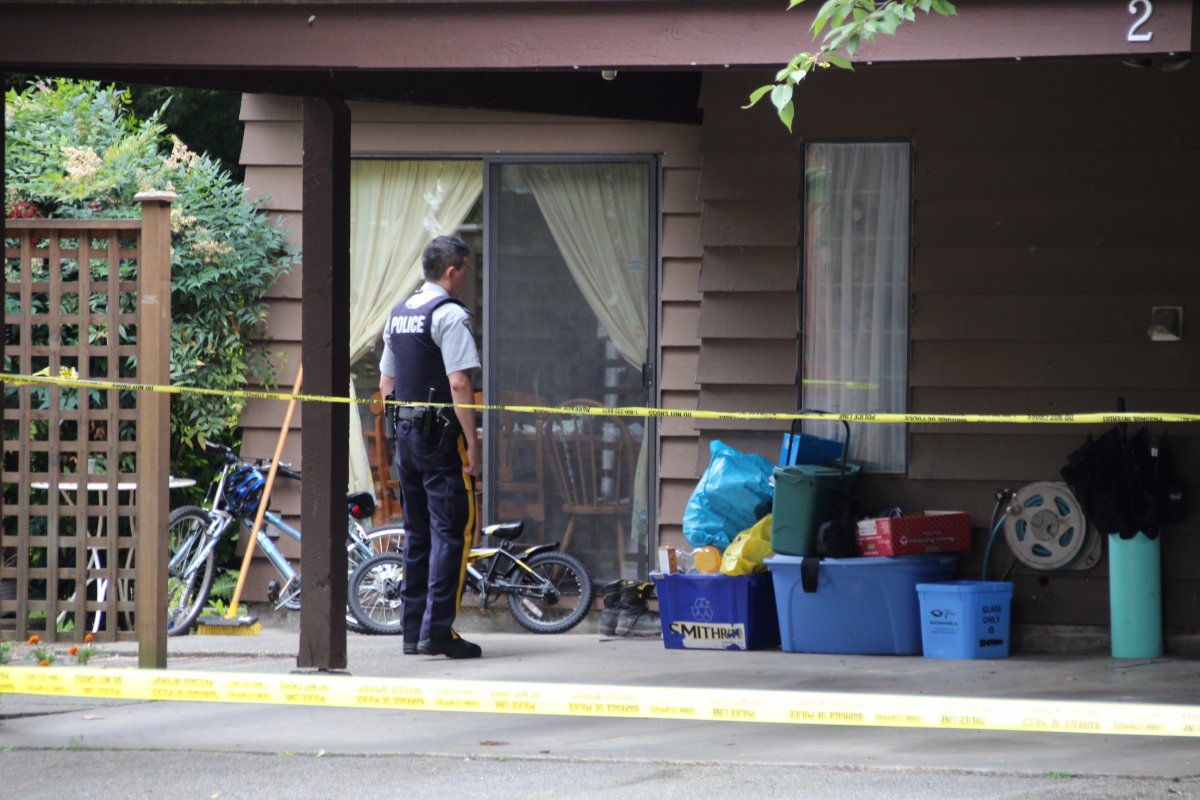 Police investigate after a body was found in a Coquitlam townhouse on July 15, 2016. 