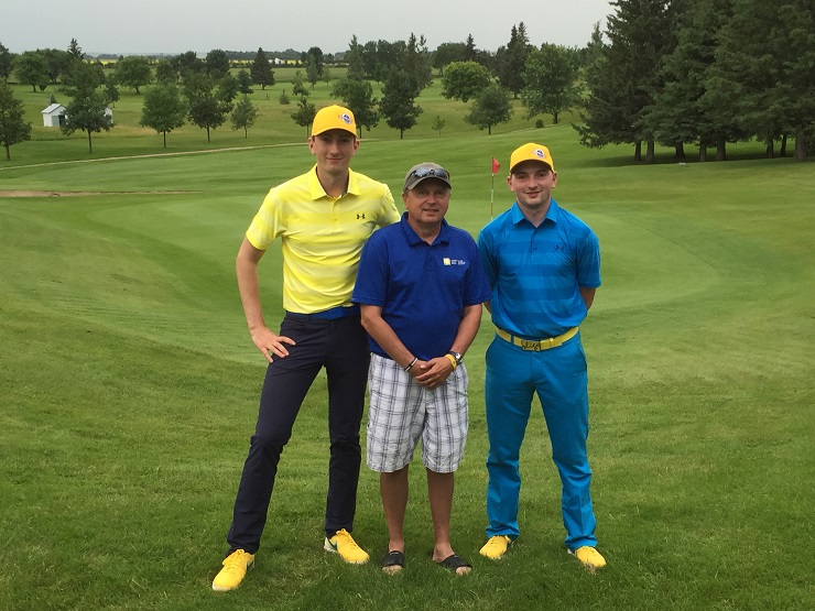 Dylan Thornbornbourough (left) and Patrick Law (right) pose with Rod Tutkaluke (center) from the Canadian Cancer Society. 