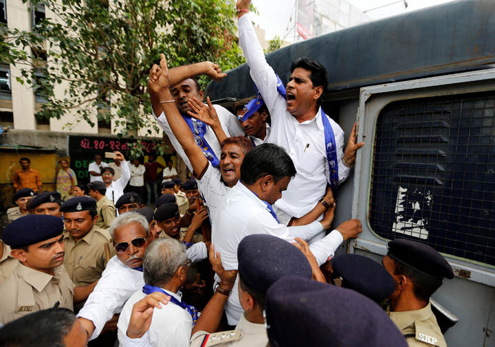 Supporters of Bahujan Samaj Party (BSP) shout slogans as they are detained by police during a protest demanding the arrest of Dayashankar Singh, a leader of India's ruling Bharatiya Janata Party (BJP), who the supporters said made derogatory comments against its party chief Mayawati, in Ahmedabad, India, July 21, 2016. 