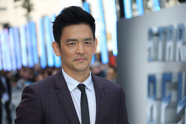 Actor John Cho poses for photographers upon arrival at the premiere of the film 'Star Trek Beyond' in London, Tuesday, July 12, 2016.