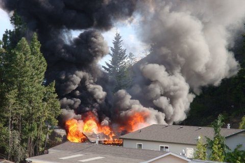 A garage fire spread to trees and damaged nearby homes Wednesday evening in West Kelowna. 