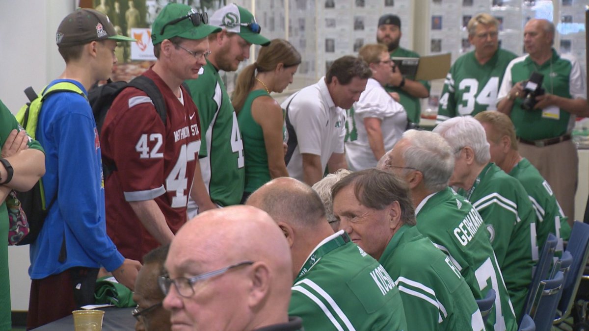 1966 Grey Cup champions meet with fans at Saskatchewan Sports Hall of Fame.