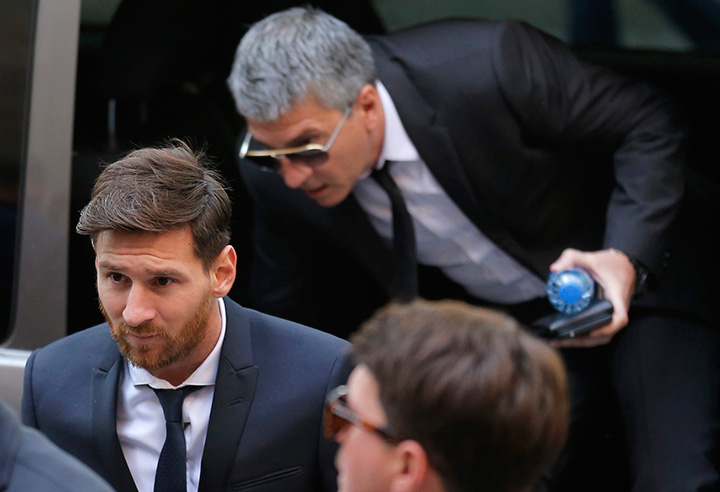In this Thursday June 2, 2016 file photo, Barcelona soccer player Lionel Messi arrives at a court in Barcelona, Spain. 