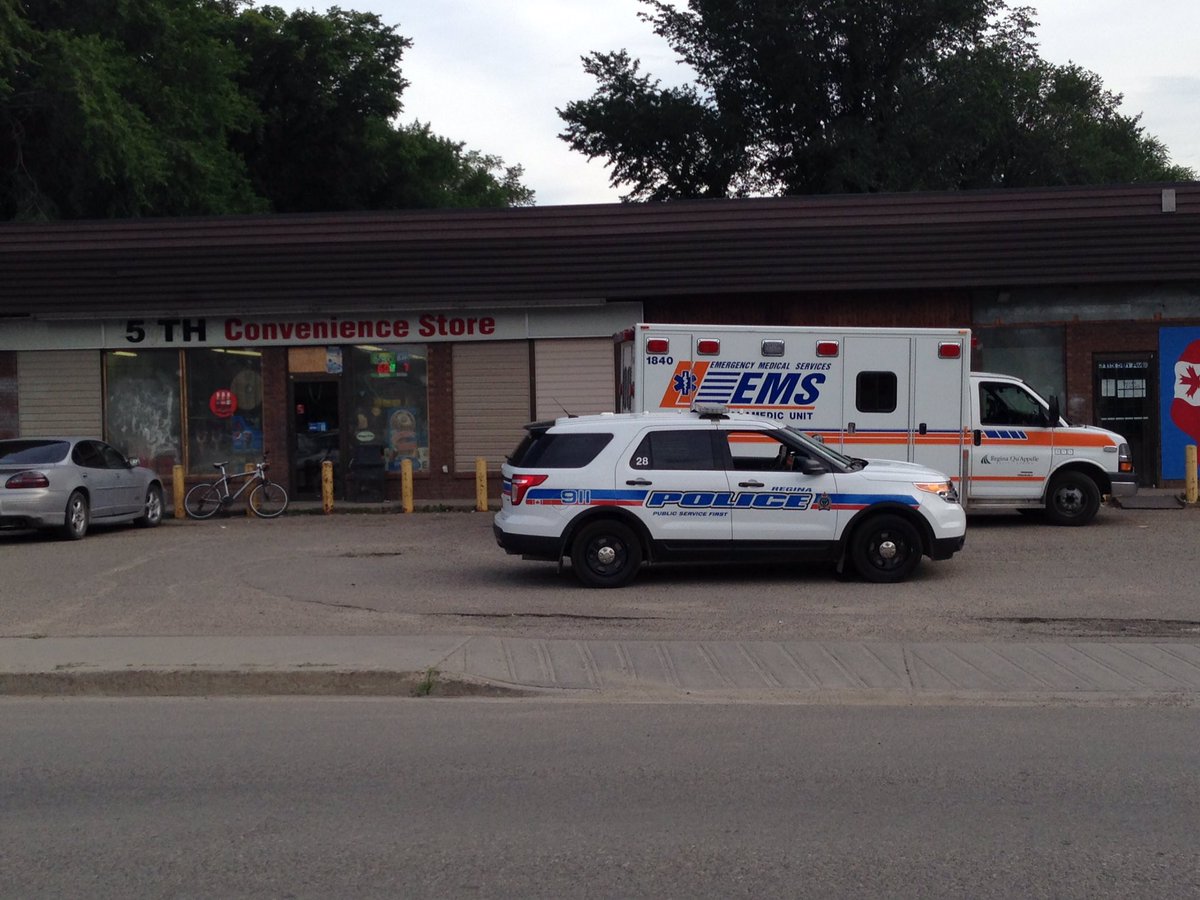 Police on scene in front of 5th avenue convenience store where man was found injured.