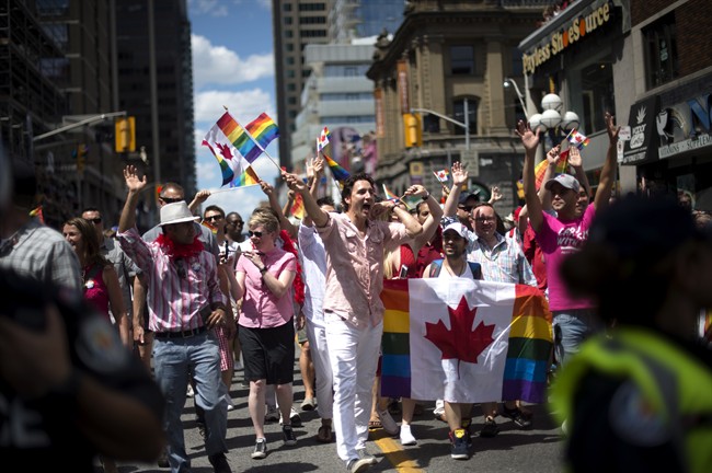 Prime Minister Justin Trudeau waves to spectators at the annual Pride Parade in Toronto on July 3. Trudeau is also showing his support for the Pride march in Steinbach this weekend. 