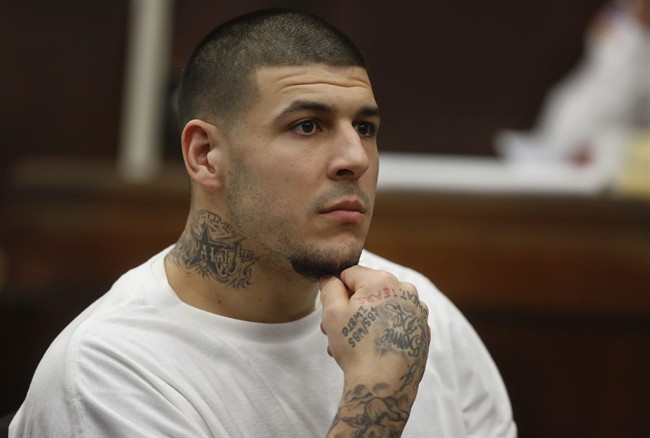 Former New England Patriots NFL football player Aaron Hernandez attends a pre-trial hearing at Suffolk Superior Court in Boston, Dec. 22, 2015.