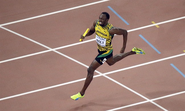 In this Aug. 29, 2015, file photo, Jamaica's Usain Bolt, right, anchors the Jamaican team to the finish line as Jamaica wins the men's 4x100 meter relay final at the World Athletics Championships in Beijing. Jamaican officials say Bolt has withdrawn from his country's National Senior Championships, citing an unspecified injury. Bolt had qualified for the 100-meter final on Friday, July 1, 2016, and was scheduled to compete in the 200-meter events Saturday and Sunday.