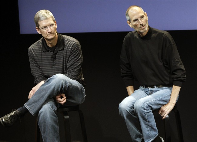 This July 16, 2010, file photo shows Apple's Tim Cook, left, and Steve Jobs, right, during a meeting at Apple in Cupertino, Calif.