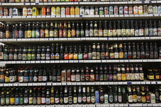 File: A shelf is stocked high with hundreds of varieties of single beers.