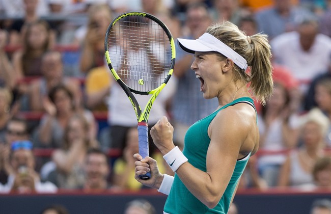 Eugenie Bouchard of Canada celebrates her victory over Dominika Cibulkova of Slovakia during second round of play at the Rogers Cup tennis tournament Wednesday July 27, 2016 in Montreal. Researchers looked at over 8,000 Grand Slam tennis games – including matches from the Australian Open, the US Open, the French Open, and Wimbledon – factoring in the multi-million dollar prizes at stakes for athletes. THE CANADIAN PRESS/Paul Chiasson.