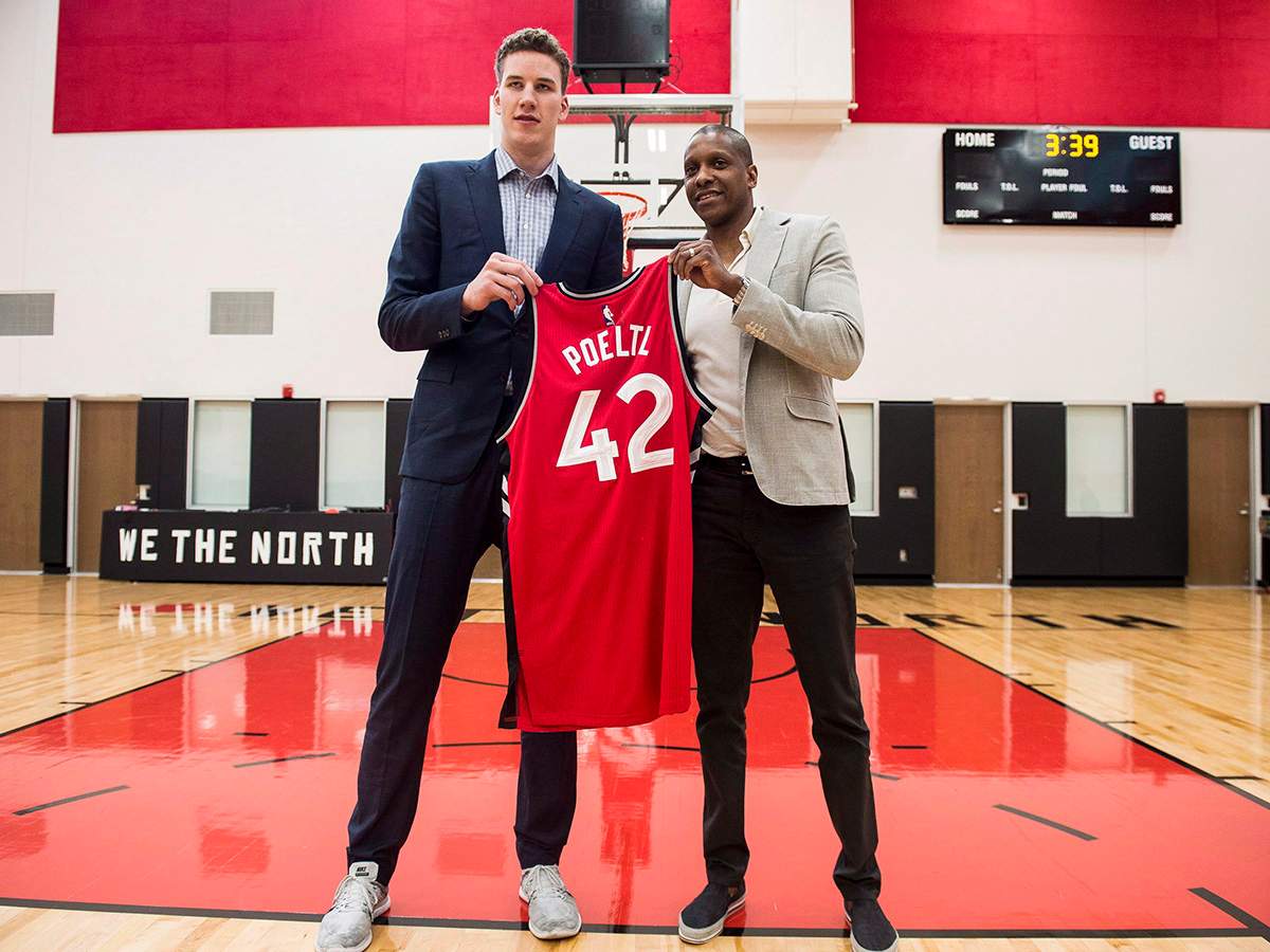 Raptors President and General Manager Masai Ujiri gives Raptors 2016 first round draft pick Jakob Poeltl, his first Raptors jersey at the BioSteel Centre, in Toronto, on Friday, June 24, 2016.