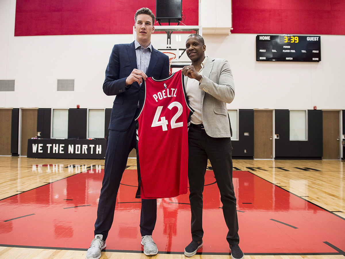 Raptors President and General Manager Masai Ujiri gives Raptors 2016 first round draft pick Jakob Poeltl, his first Raptors jersey at the BioSteel Centre, in Toronto, on Friday, June 24, 2016.