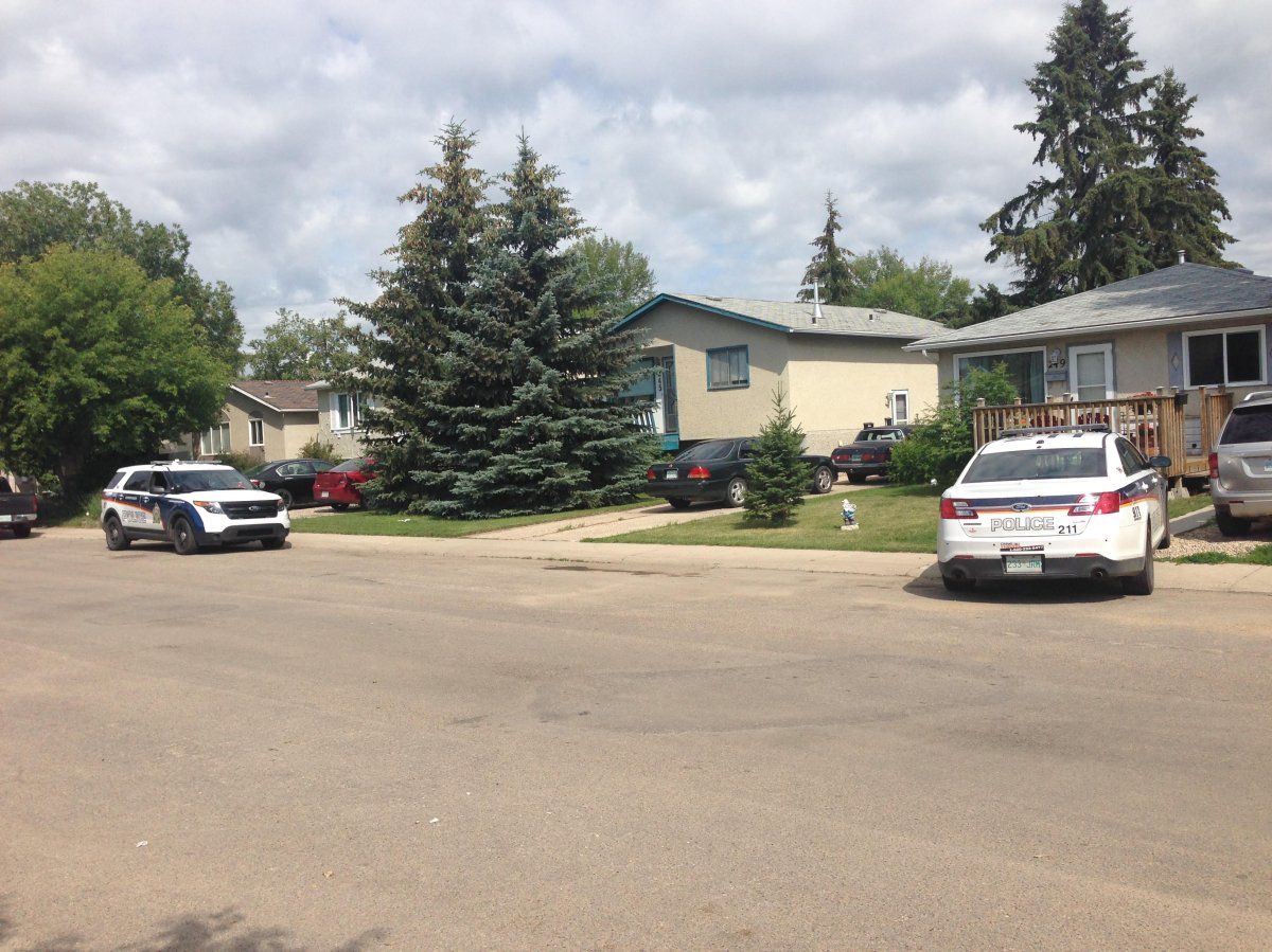 Saskatoon police patrol cars parked outside of a home in the 200 block of Waterloo Crescent Sunday morning where authorities say an infant was killed.