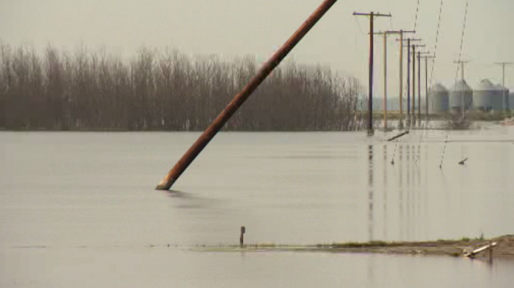 Water in Quill Lakes overflows basin, flooding area farm land. - September 10, 2015.