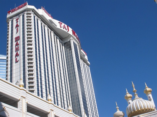 This June 30, 2016 photo shows the exterior of the Trump Taj Mahal casino in Atlantic City, N.J. as talks were underway between its owners and the city's main casino workers union to try to head off a threatened Friday strike. Local 54 of the Unite-HERE union reached new contracts on Thursday, June 30, 2016 with four of the five casinos it had threatened to strike.