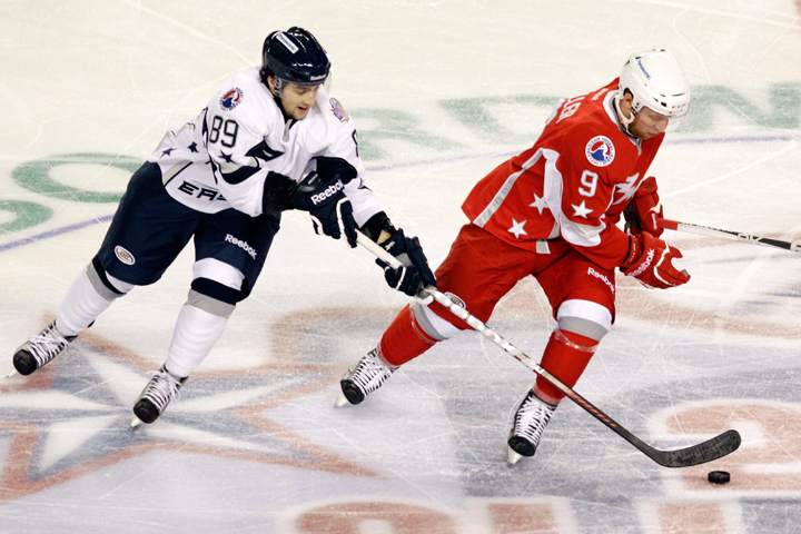 Eastern Conference's Cory Conacher (89), of the Norfolk Admirals, tries to control the puck past Western Conference's Ryan Keller, of the Oklahoma City Barons, during the second period of the AHL All Star hockey game in Atlantic City, N.J., Monday, Jan. 30, 2012. Keller announced his retirement from professional hockey on July 14, 2016 after 11 seasons.